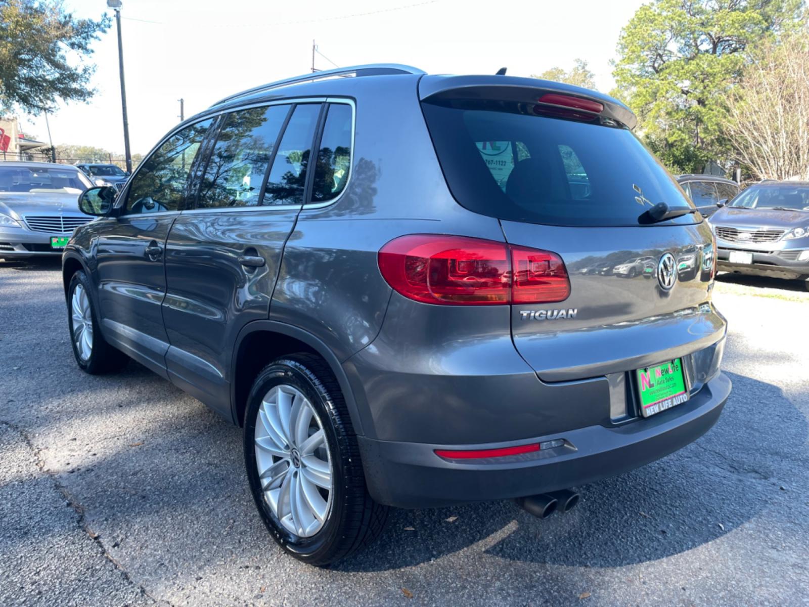 2015 GRAY VOLKSWAGEN TIGUAN S (WVGAV7AX3FW) with an 2.0L engine, Automatic transmission, located at 5103 Dorchester Rd., Charleston, SC, 29418-5607, (843) 767-1122, 36.245171, -115.228050 - Local Trade-in with Leather, Panoramic Sunroof, Navigation, Backup Camera, Fender Stereo with CD/AUX/Bluetooth, Dual Climate Control, Power Everything (windows, locks, seats, mirrors), Heated Seats, Push Button Start, Keyless Entry, Alloy Wheels. Clean CarFax (no accidents reported!) 102k miles Loc - Photo #5